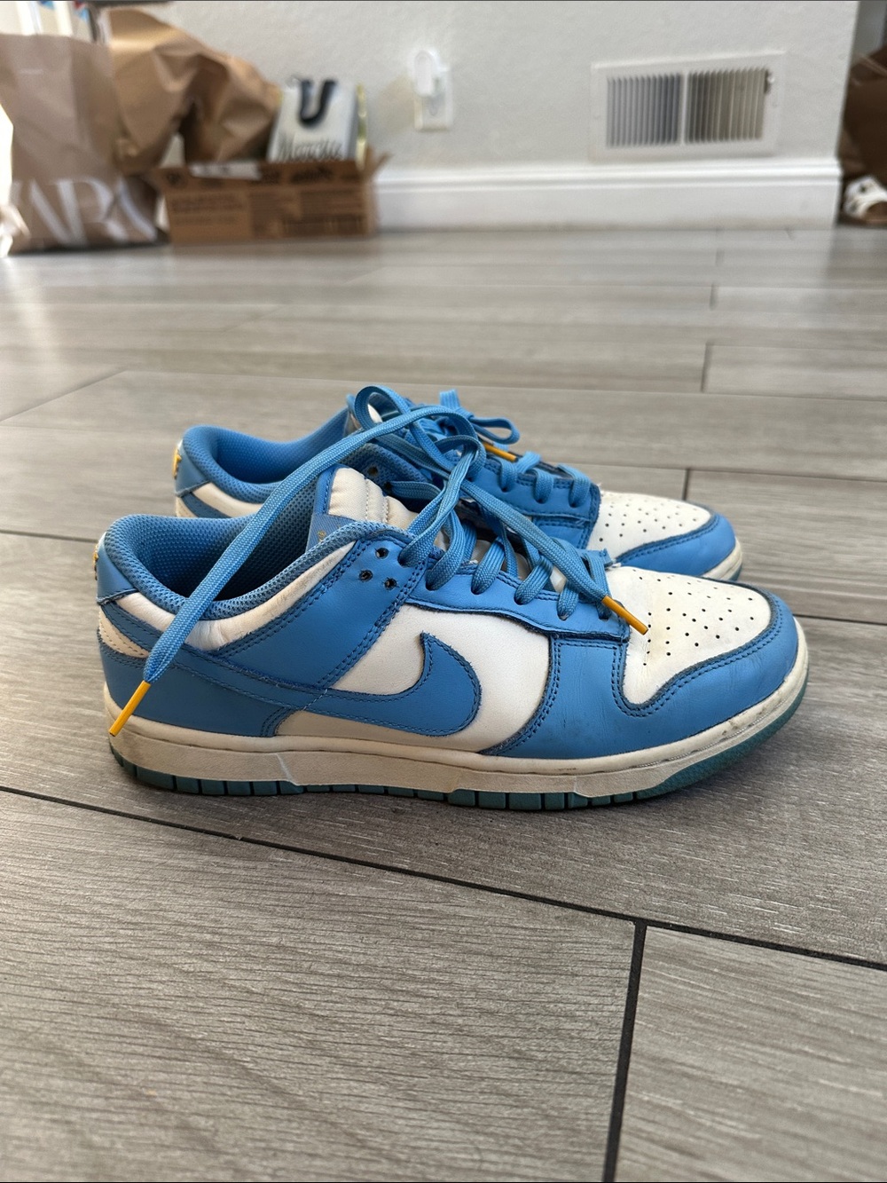 Nike Blue and White Low-Top Sneakers with Yellow Lace Tips